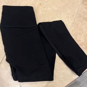Lululemon black leggings with laser cutting size 4